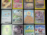 a lot of pokemon cards that are on the table
