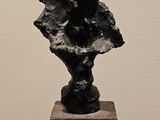 sculpture of a black sculpture on a wooden table