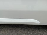 a close up of a car door handle with a sticker on it