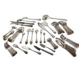 an assortment of silverware including forks and spoons on a white surface