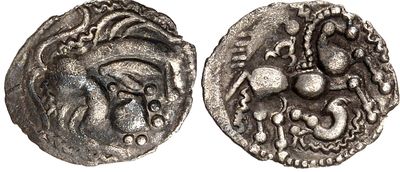 a silver coin with an image of a woman on it