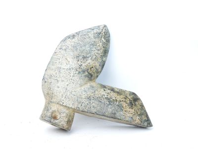 a stone object that looks like a hammer on a white surface