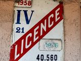 a red and white sign on the side of a building