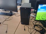 a desktop computer sitting on top of a wooden desk