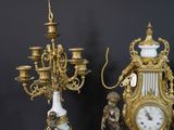 two clocks that are sitting next to each other on a table