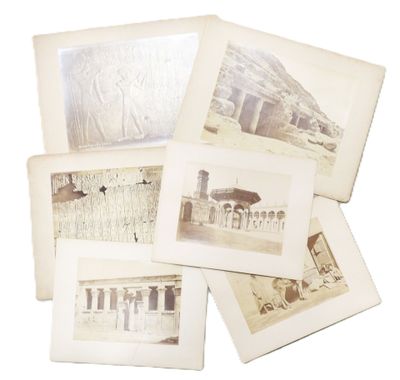 several old photographs of a building and a bird on a white background