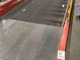 a conveyor belt in a warehouse with boxes on it