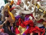 a pile of yarn on a table next to scissors
