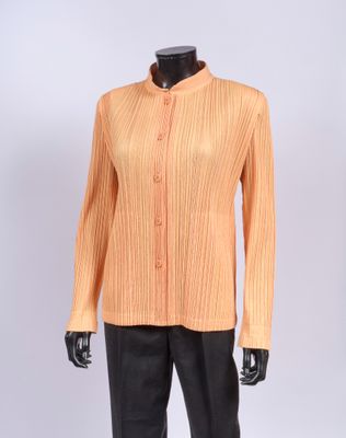 a mannequin mannequin wearing an orange shirt and black pants