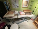 a picture of a room with a desk and a chair in it