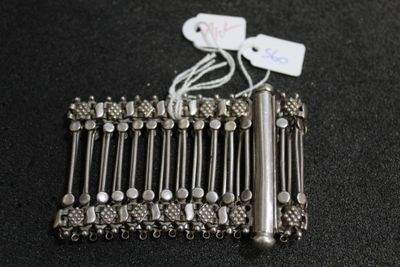 a silver bracelet that has a bunch of beads on it