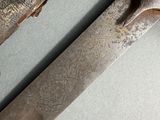a close up of a knife that is on a table