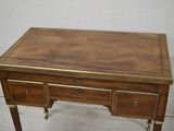 a wooden desk with two drawers and a drawer underneath it