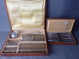 a box with silverware in it on a blue background