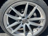 a close up of a car tire on the road