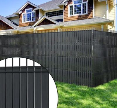 black vinyl fence with a picture of a house in the background