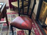 a chair that is sitting in front of a fire place