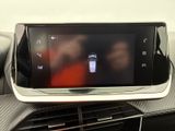a picture of a cell phone in the center of a car