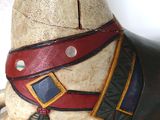 a close up of a statue of a horse wearing a harness