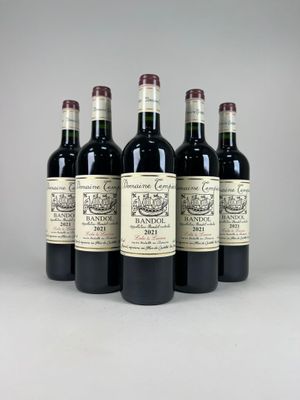 four bottles of wine are lined up in a row