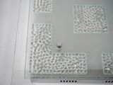 a glass table with a glass top that has a ring on it