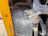 a close up of a machine with a hose attached to the back of it