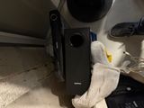 a stuffed animal that is sitting next to a speaker