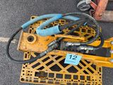 a yellow crate with a bunch of hoses on top of it