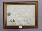 an old document is hanging on a wall in a room