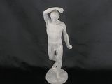white marble statue of a man holding a hat on a black background