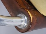 a close up of a chair with a metal handle