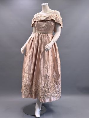 a mannequin dress on display on a mannequin stand