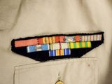 a military uniform with a medal on the back of it