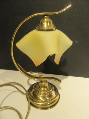 a lamp that is sitting on a table next to a wall