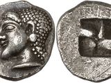 a silver coin with an image of a man ' s face on it