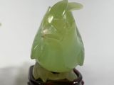 two figurines of birds sitting on top of each other