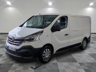 the white van is parked on a checkered floor in a room