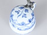a small blue and white box with a bird on it