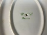a close up of a plate with a name on it