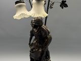 a lamp that is sitting on a table with a lamp on top of it