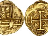 a gold coin with an image of a cross on it