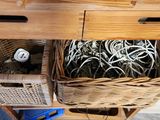 a wooden table with two baskets on top of it
