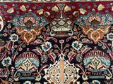 a close up of an oriental rug with many different colors and patterns