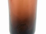 a brown glass vase with a black lid
