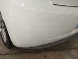 a white car that is parked in a garage