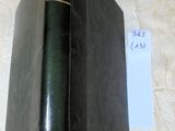 a black book on a table with a price tag on it