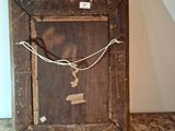 a picture of a wooden frame with a rope on it