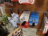 a rack with many different items on it in a store
