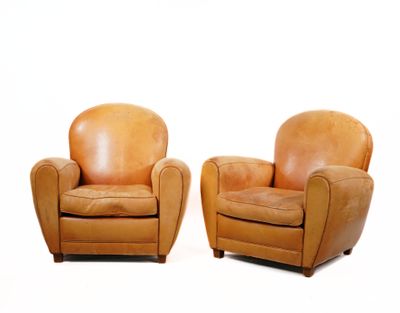 two brown leather chairs sitting next to each other on a white surface