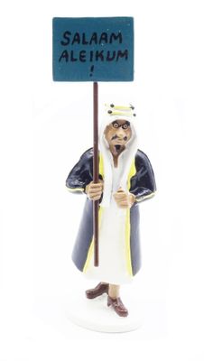 figurine of a man holding a sign that says salam alekhum
